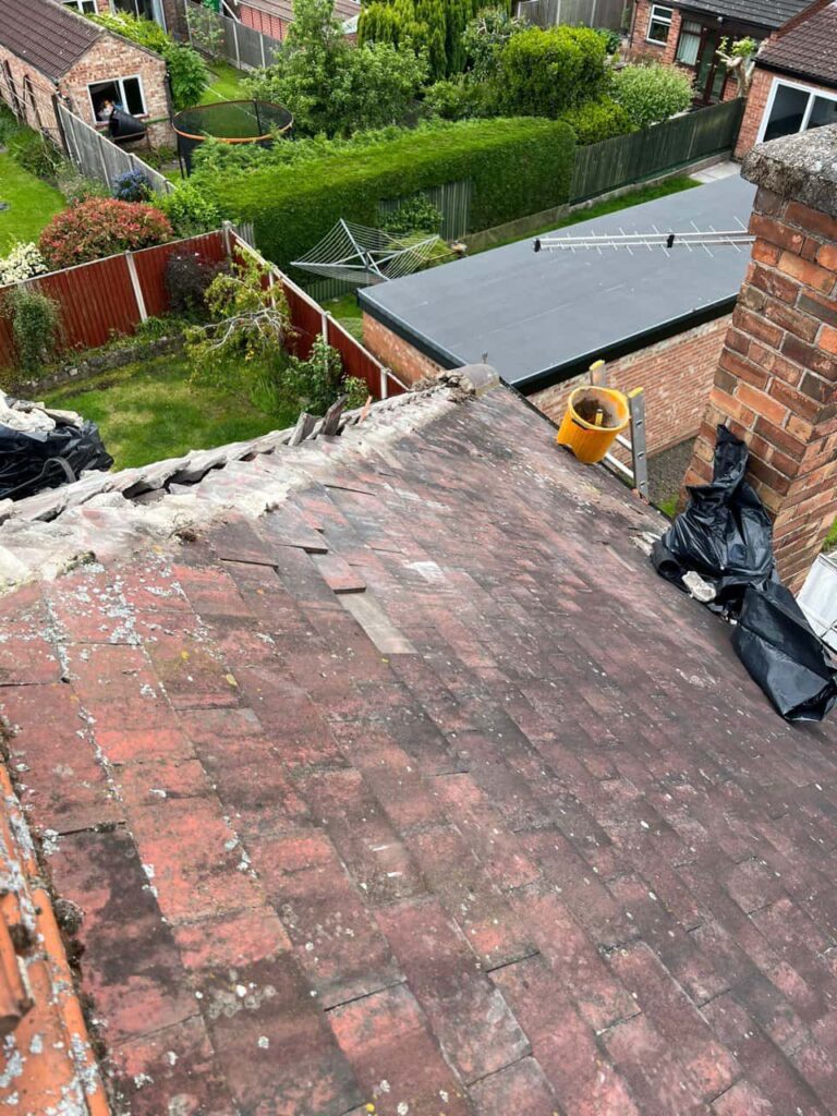 This is a photo of a roof where the hip tiles have been removed, and are just about to be replaced. Works carried out by Bingham Roofing Repairs