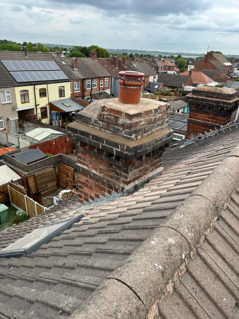 This is a photo taken from a roof which is being repaired by Bingham Roofing Repairs, it shows a street of houses, and their roofs